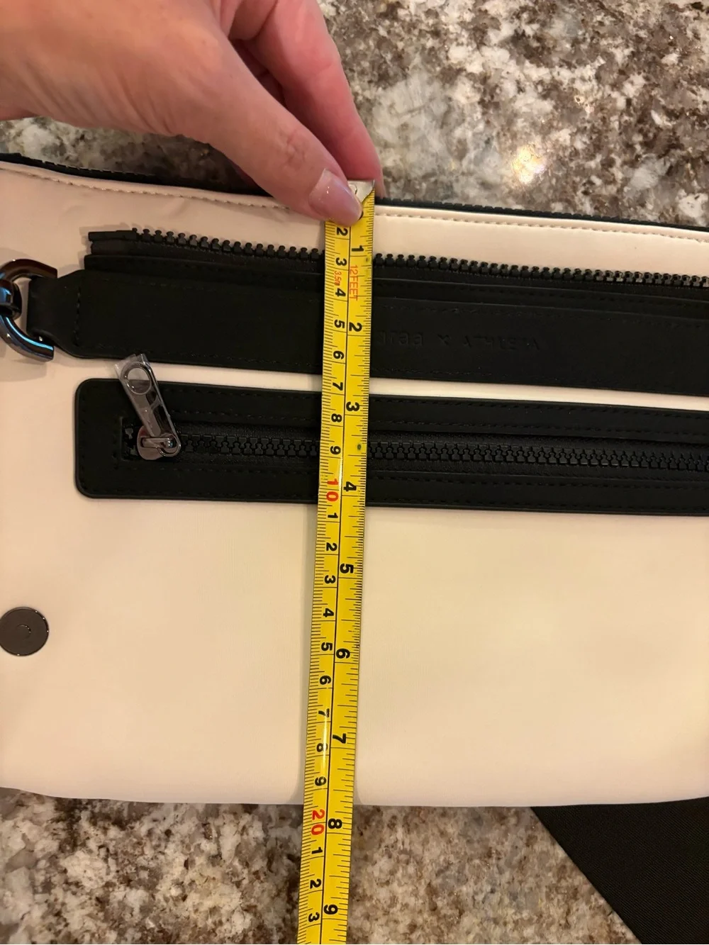 white and black Caraa x Athleta crossbody bag